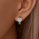 Daisy Huggie Earrings on Ear