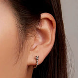 Flower_Huggie_Earrings_on_Ear