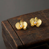 Gold Orchid Earrings Close Up View
