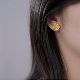 Gold Plated Flower Earrings on Ear