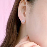 Magnolia Silver Earrings on Ear
