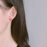 Peach Blossom Earrings on Ear