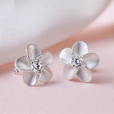 Plumeria Stud Earrings Close-Up View