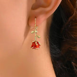 Red Rose Dangle Earrings on Ear