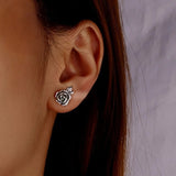 Retro Rose Earrings on Ear