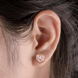 Rose Gold Rose Stud Earrings on Ear