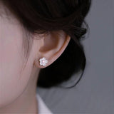 Sakura Stud Earrings on Ear