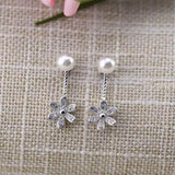 Silver Daisy Drop Earrings Close Up View