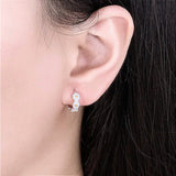 Silver Daisy Hoop Earrings on Ear