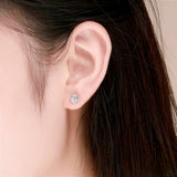 Sterling_Silver_Rose_Earrings_on_Ear