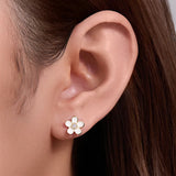 White Flower Enamel Earrings on Ear